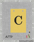 A taped needlepoint canvas with the design: Banner 13 mesh count Squared C Black on Yellow.