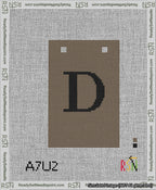 A taped needlepoint canvas with the design: Banner 13 mesh count Squared D Black on Brown.