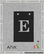 A taped needlepoint canvas with the design: Banner 13 mesh count Squared E White on Black.