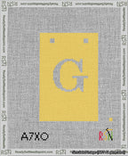 A taped needlepoint canvas with the design: Banner 13 mesh count Squared G White on Yellow.