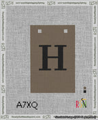 A taped needlepoint canvas with the design: Banner 13 mesh count Squared H Black on Brown.