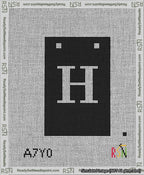 A taped needlepoint canvas with the design: Banner 13 mesh count Squared H White on Black.