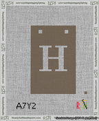 A taped needlepoint canvas with the design: Banner 13 mesh count Squared H White on Brown.