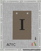A taped needlepoint canvas with the design: Banner 13 mesh count Squared I Black on Brown.