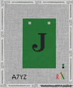 A taped needlepoint canvas with the design: Banner 13 mesh count Squared J Black on Green.