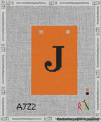 A taped needlepoint canvas with the design: Banner 13 mesh count Squared J Black on Orange.