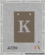 A taped needlepoint canvas with the design: Banner 13 mesh count Squared K White on Brown.