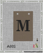 A taped needlepoint canvas with the design: Banner 13 mesh count Squared M Black on Brown.