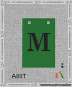 A taped needlepoint canvas with the design: Banner 13 mesh count Squared M Black on Green.