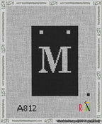 A taped needlepoint canvas with the design: Banner 13 mesh count Squared M White on Black.