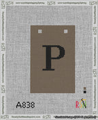 A taped needlepoint canvas with the design: Banner 13 mesh count Squared P Black on Brown.