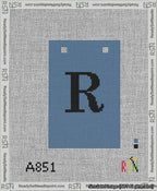 A taped needlepoint canvas with the design: Banner 13 mesh count Squared R Black on Blue.