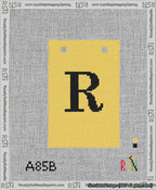 A taped needlepoint canvas with the design: Banner 13 mesh count Squared R Black on Yellow.