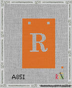 A taped needlepoint canvas with the design: Banner 13 mesh count Squared R White on Orange.