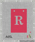 A taped needlepoint canvas with the design: Banner 13 mesh count Squared R White on Red.