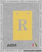 A taped needlepoint canvas with the design: Banner 13 mesh count Squared R White on Yellow.