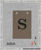 A taped needlepoint canvas with the design: Banner 13 mesh count Squared S Black on Brown.