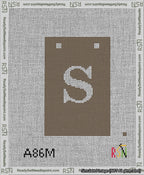 A taped needlepoint canvas with the design: Banner 13 mesh count Squared S White on Brown.