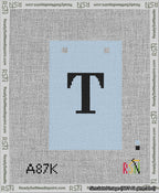 A taped needlepoint canvas with the design: Banner 13 mesh count Squared T Black on Light Blue.