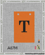 A taped needlepoint canvas with the design: Banner 13 mesh count Squared T Black on Orange.