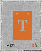 A taped needlepoint canvas with the design: Banner 13 mesh count Squared T White on Orange.