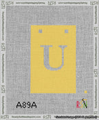 A taped needlepoint canvas with the design: Banner 13 mesh count Squared U White on Yellow.