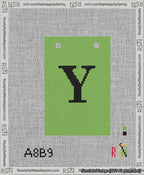 A taped needlepoint canvas with the design: Banner 13 mesh count Squared Y Black on Light Green.