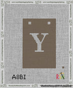 A taped needlepoint canvas with the design: Banner 13 mesh count Squared Y White on Brown.
