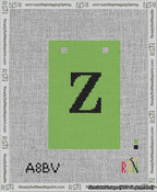 A taped needlepoint canvas with the design: Banner 13 mesh count Squared Z Black on Light Green.