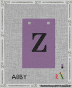 A taped needlepoint canvas with the design: Banner 13 mesh count Squared Z Black on Purple.