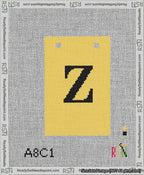 A taped needlepoint canvas with the design: Banner 13 mesh count Squared Z Black on Yellow.