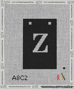 A taped needlepoint canvas with the design: Banner 13 mesh count Squared Z White on Black.