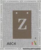 A taped needlepoint canvas with the design: Banner 13 mesh count Squared Z White on Brown.