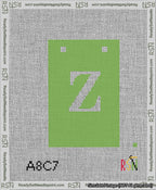 A taped needlepoint canvas with the design: Banner 13 mesh count Squared Z White on Light Green.