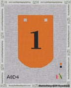 A taped needlepoint canvas with the design: Banner 18 mesh count Curved 1 Black on Orange.