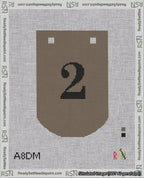 A taped needlepoint canvas with the design: Banner 18 mesh count Curved 2 Black on Brown.