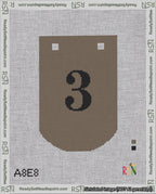 A taped needlepoint canvas with the design: Banner 18 mesh count Curved 3 Black on Brown.