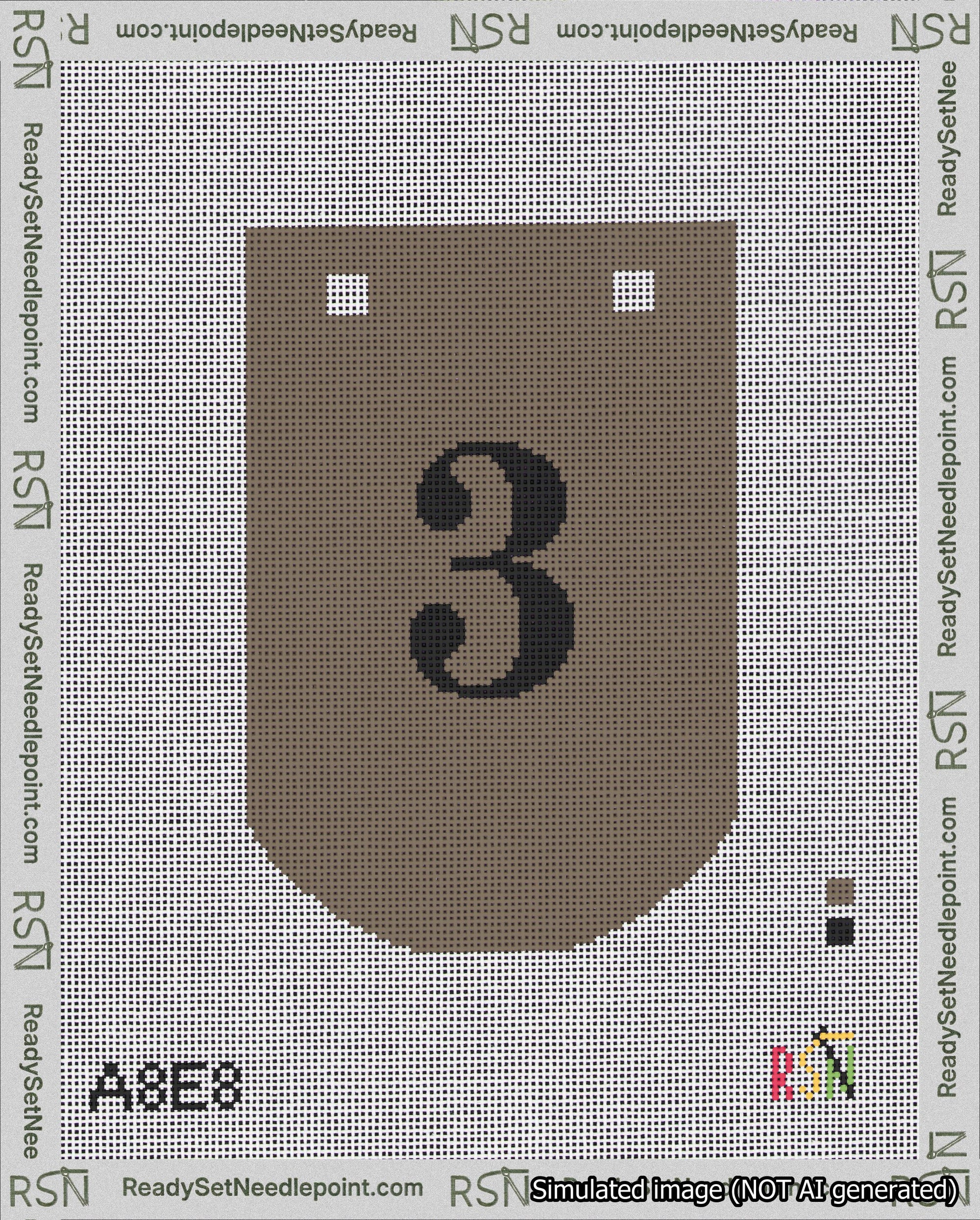 A taped needlepoint canvas with the design: Banner 18 mesh count Curved 3 Black on Brown.