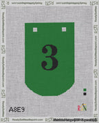 A taped needlepoint canvas with the design: Banner 18 mesh count Curved 3 Black on Green.