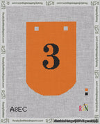 A taped needlepoint canvas with the design: Banner 18 mesh count Curved 3 Black on Orange.