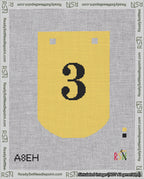 A taped needlepoint canvas with the design: Banner 18 mesh count Curved 3 Black on Yellow.