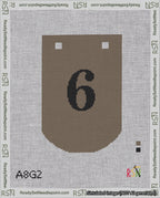 A taped needlepoint canvas with the design: Banner 18 mesh count Curved 6 Black on Brown.