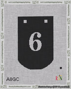A taped needlepoint canvas with the design: Banner 18 mesh count Curved 6 White on Black.