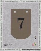 A taped needlepoint canvas with the design: Banner 18 mesh count Curved 7 Black on Brown.
