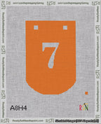 A taped needlepoint canvas with the design: Banner 18 mesh count Curved 7 White on Orange.