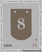 A taped needlepoint canvas with the design: Banner 18 mesh count Curved 8 White on Brown.