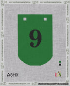 A taped needlepoint canvas with the design: Banner 18 mesh count Curved 9 Black on Green.