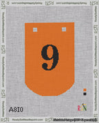 A taped needlepoint canvas with the design: Banner 18 mesh count Curved 9 Black on Orange.