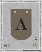 A taped needlepoint canvas with the design: Banner 18 mesh count Curved A Black on Brown.