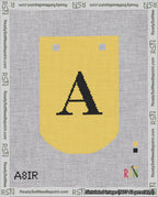 A taped needlepoint canvas with the design: Banner 18 mesh count Curved A Black on Yellow.